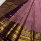 Gold-zari buttas on the Dusty Mauve-Lilac Kanchipuram Zari Kattam silk.