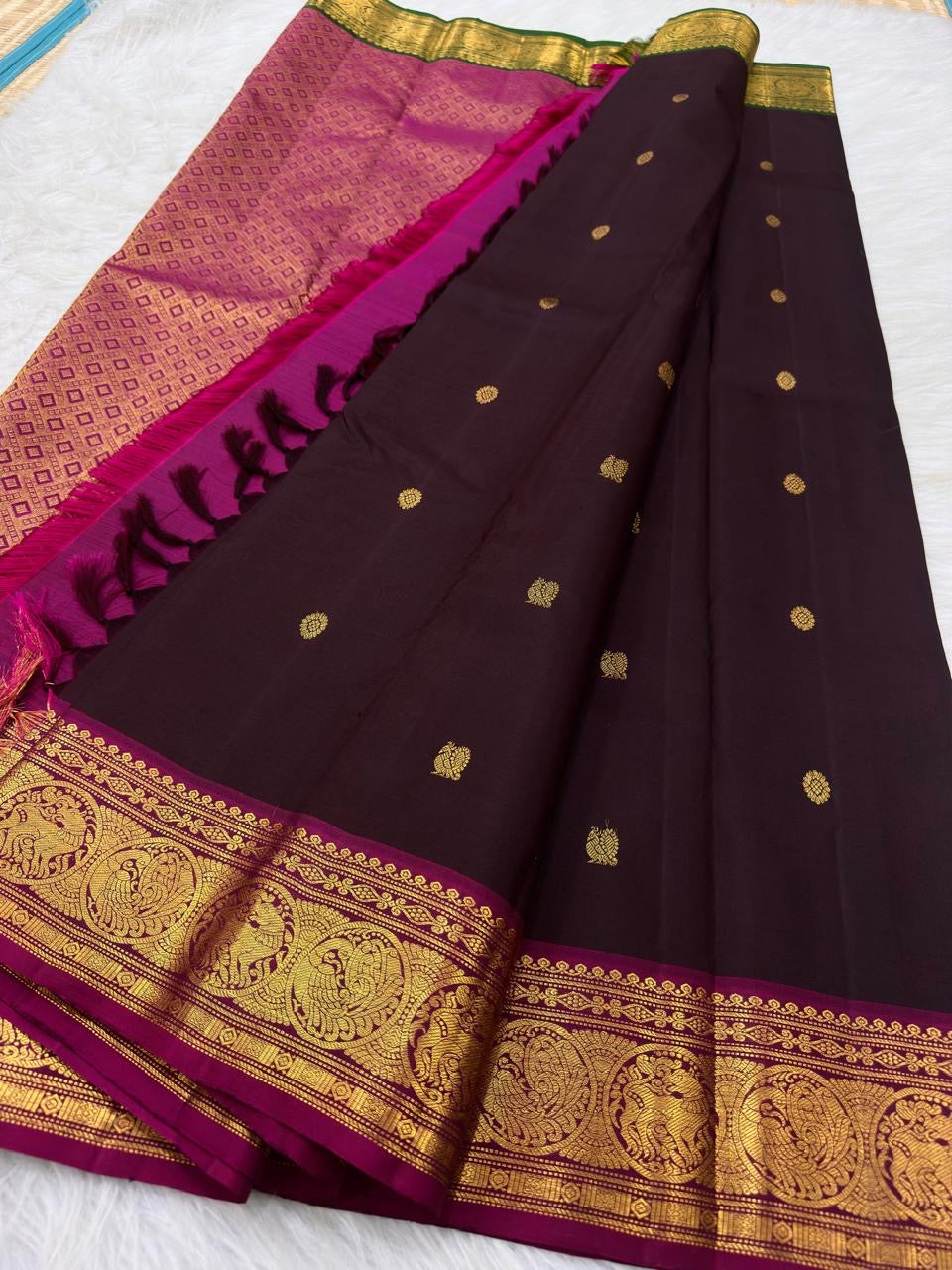 Gold zari Mayil Chakram buttas on deep chocolate brown pure silk