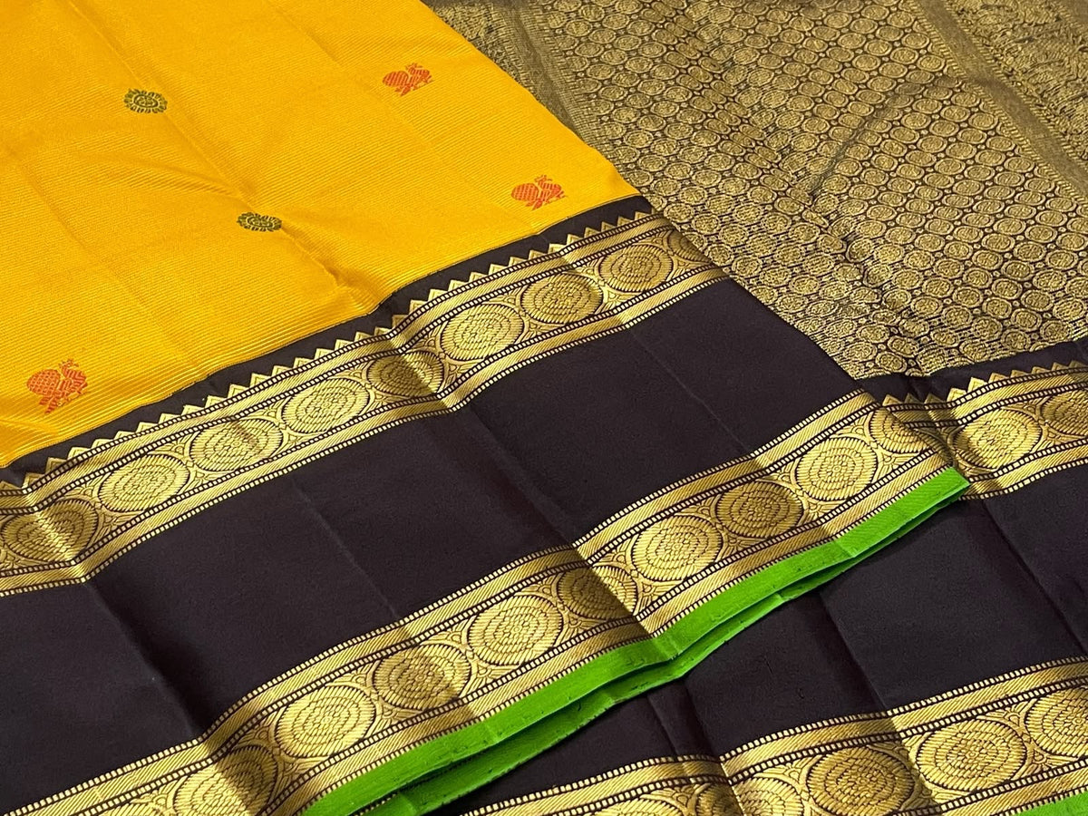 Turmeric Yellow Handwoven Pure Silk Kanchipuram Saree with Rettapet Border and Mayil Chakram, body and border detail