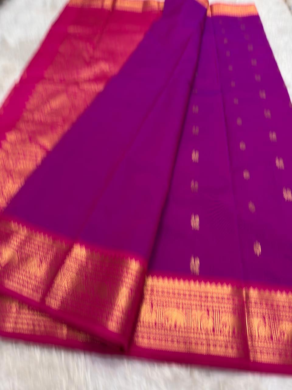 Rich purple Kanchi pattu saree with lightweight drape and woven gold zari