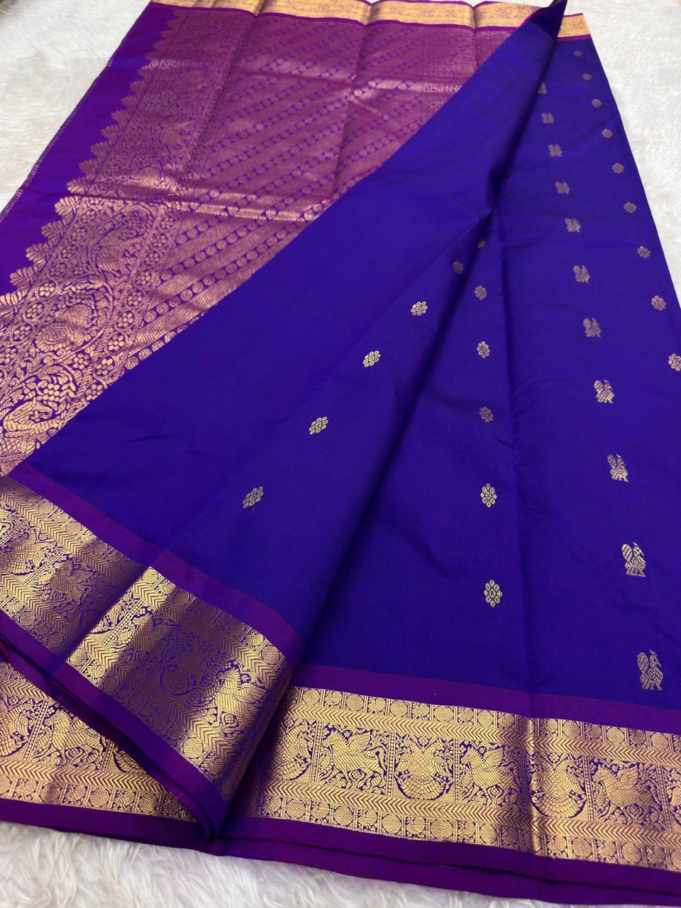 Luxury violet korvai silk saree with richly woven traditional gold zari pallu