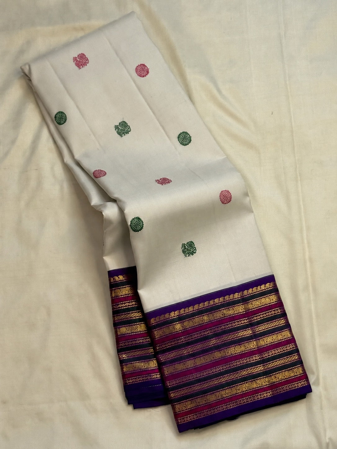Violet zari pallu and layered Varisaipet border on a white vintage Kanchipuram silk saree.