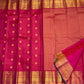 Mayil Chakram zari motif detail on the fuchsia pink Kanchipuram saree
