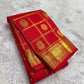 Mayil Chakram zari motif detail on the vermilion orange Kanchipuram saree