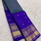 Mayil Kazhuthu blue-green handwoven pure silk Kanjivaram Butta saree with Royal Purple contrast.