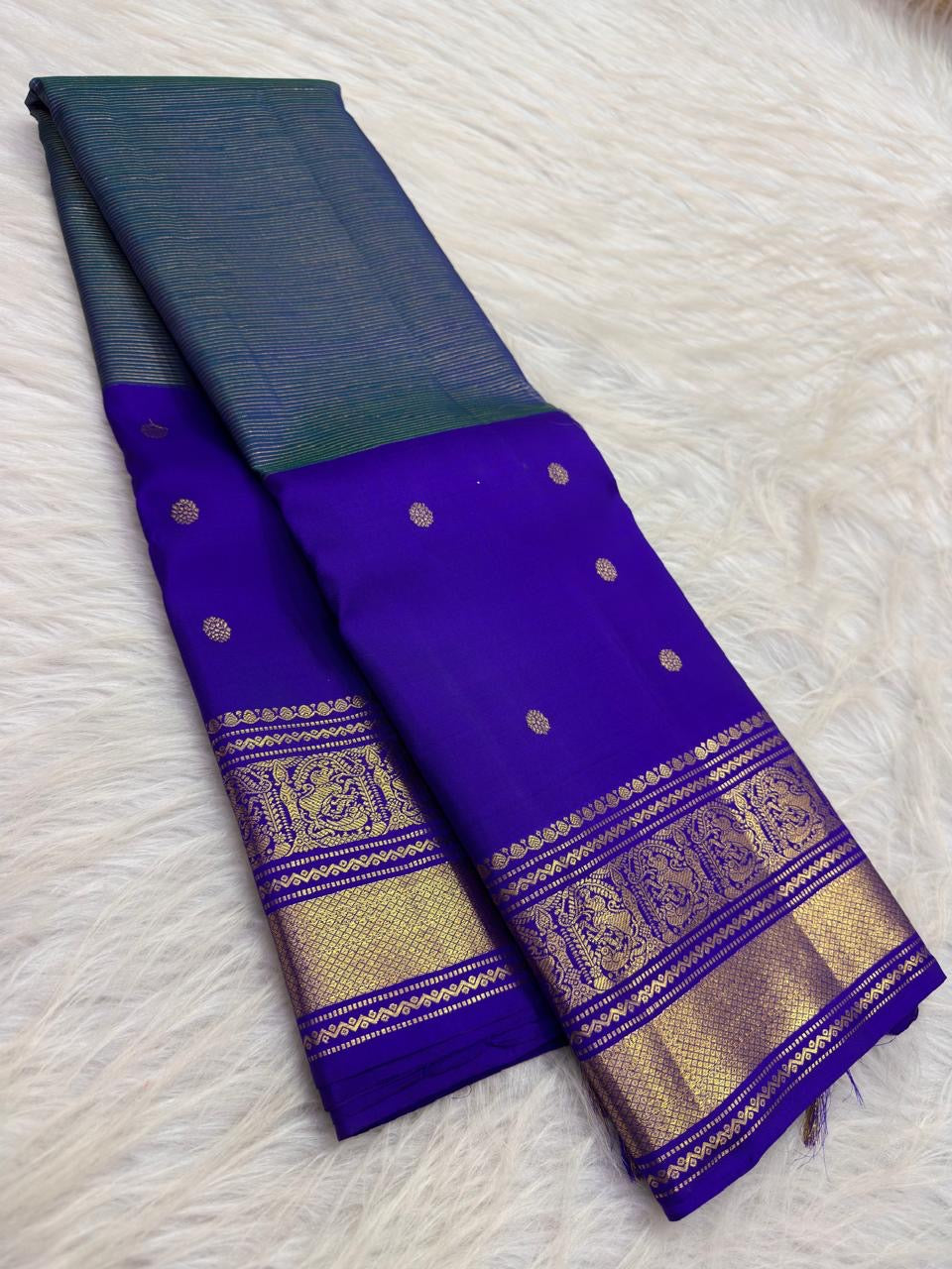 Mayil Kazhuthu blue-green handwoven pure silk Kanjivaram Butta saree with Royal Purple contrast.