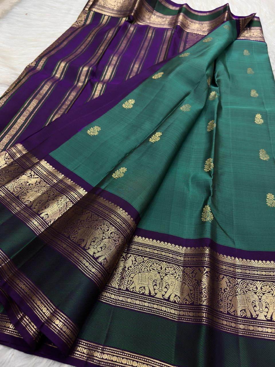 Mayil Kazhuthu Green Pure Silk Kanjivaram Butta saree with Royal Purple zari border