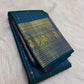 Peacock blue-green Kanjivaram silk saree with fine vertical zari lines and petite gold buttas