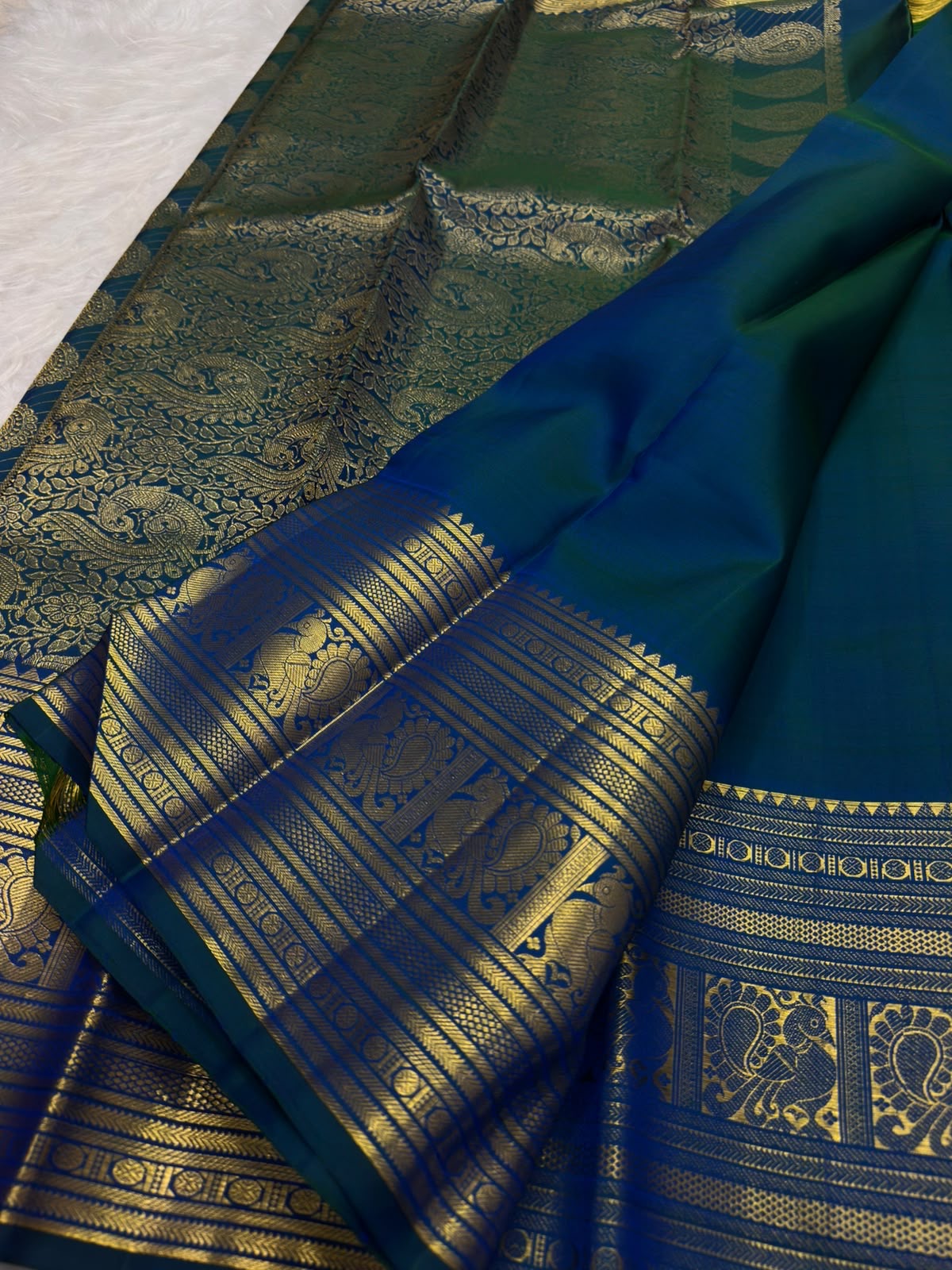 Blue-green Pure Silk Kanchipuram Butta saree with traditional sacred-bird gold zari border