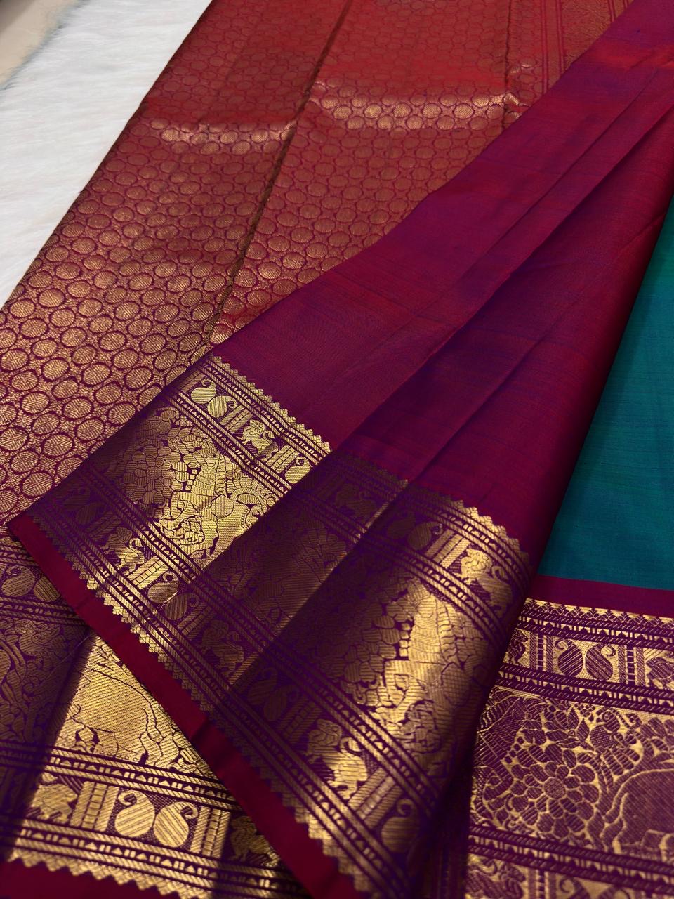 Mayil Kazhuthu Kanchipuram Saree — pallu detail with raspberry-pink and gold zari peacock work