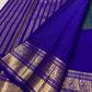 Traditional Mayil peacock border in antique gold on Royal Purple Kanjivaram silk.