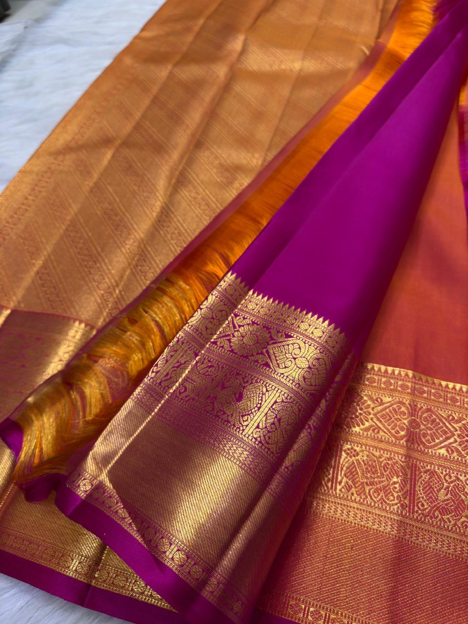 Mayil Kazhuthu silk saree with lagoon-teal colour play, Rani-pink selvedge and rich gold zari Pettu