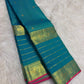 Mayil Kazhuthu Blue-Green pure silk Kanjivaram Varisaipet saree with antique-gold zari border.