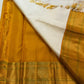 Warm Ivory Kanchipuram saree with Golden Harvest Mustard pallu
