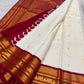 Mayilkann peacock-eye and Mayilpet peacock panels, warm-ivory Kanchipuram Korvai saree