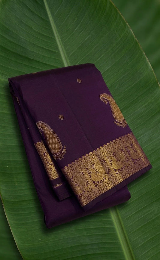 Kanchipuram silk saree in jamun purple with antique gold border Maanga Butta weave folded view