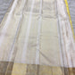 Mellow Manjal yellow Pure Silk Kanjeevaram Butta saree with ivory border