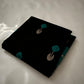 Close view of midnight-black Pattu Silk Chanderi saree body with peacock-teal accents