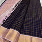 Deep Ink Navy Kancheepuram silk with understated gold Zari Kattam.