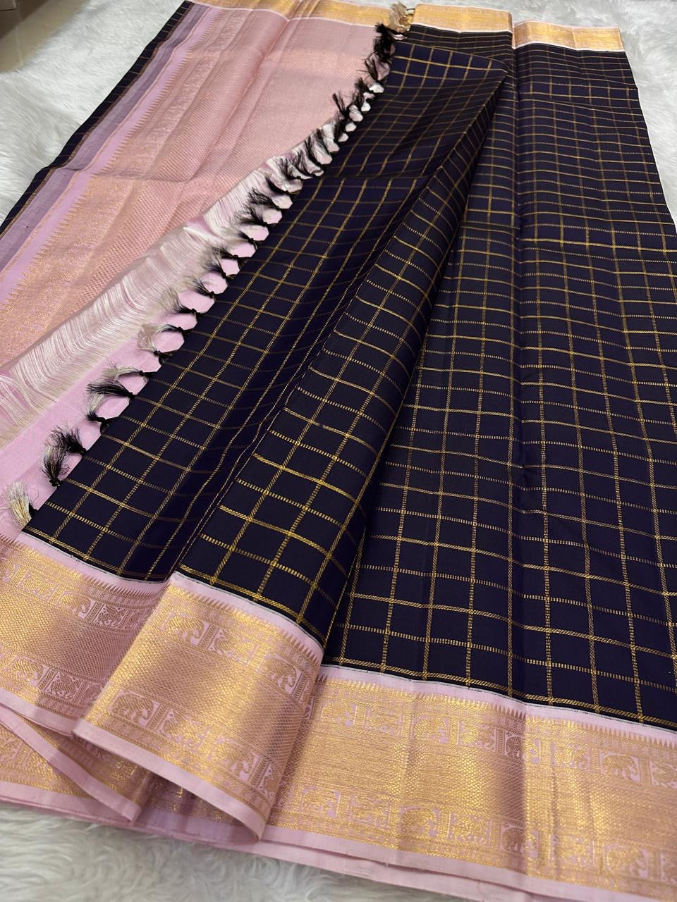 Deep Ink Navy Kancheepuram silk with understated gold Zari Kattam.
