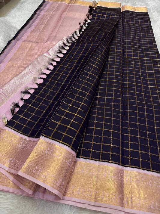 Deep Ink Navy Kancheepuram silk with understated gold Zari Kattam.