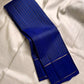 Deep royal indigo Kanchipuram silk saree with fine traditional zari stripe detailing and classic gold border folded view