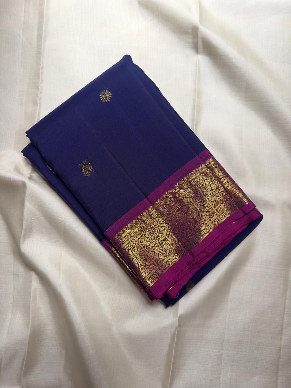 Full laid-out Vintage Pure Silk KanchiPattu saree in Midnight Indigo, Vadamalli magenta-purple and antique gold.