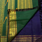Copper zari tanpura motif detail on bottle green pallu of midnight navy Kanchipuram silk saree — Idam Living