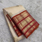 Milk White and Arakku Red Handwoven Pure Silk Kancheepuram Saree with Mayil Chakram Zari Butta and Varisaipet Border