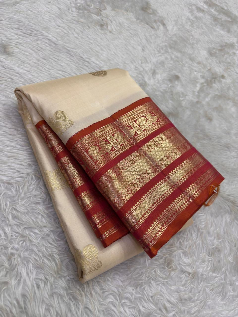Milk White and Arakku Red Handwoven Pure Silk Kancheepuram Saree with Mayil Chakram Zari Butta and Varisaipet Border