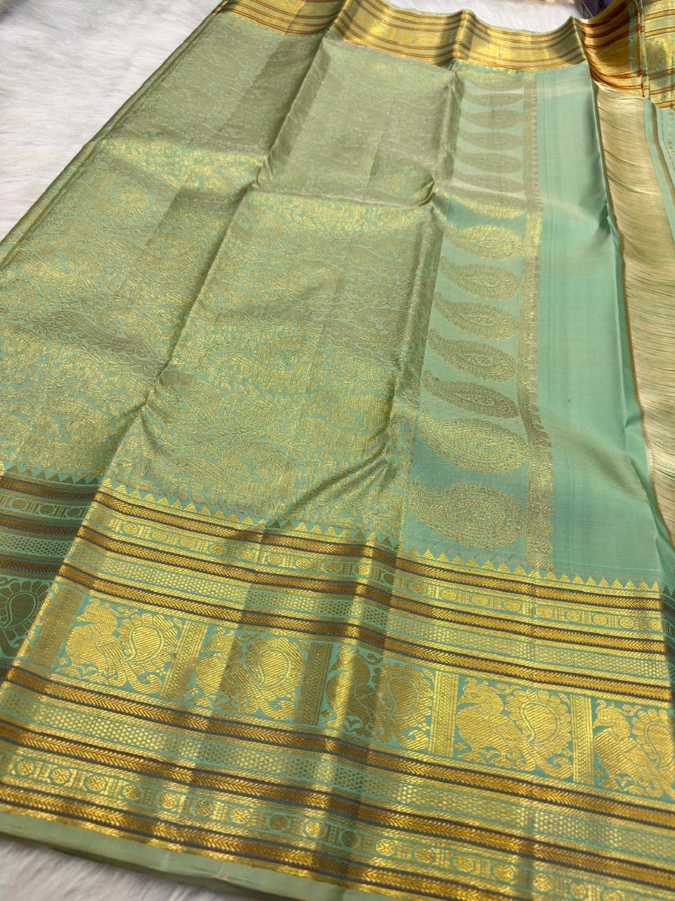 Mint Green Kanjeevaram saree peacock border close-up
