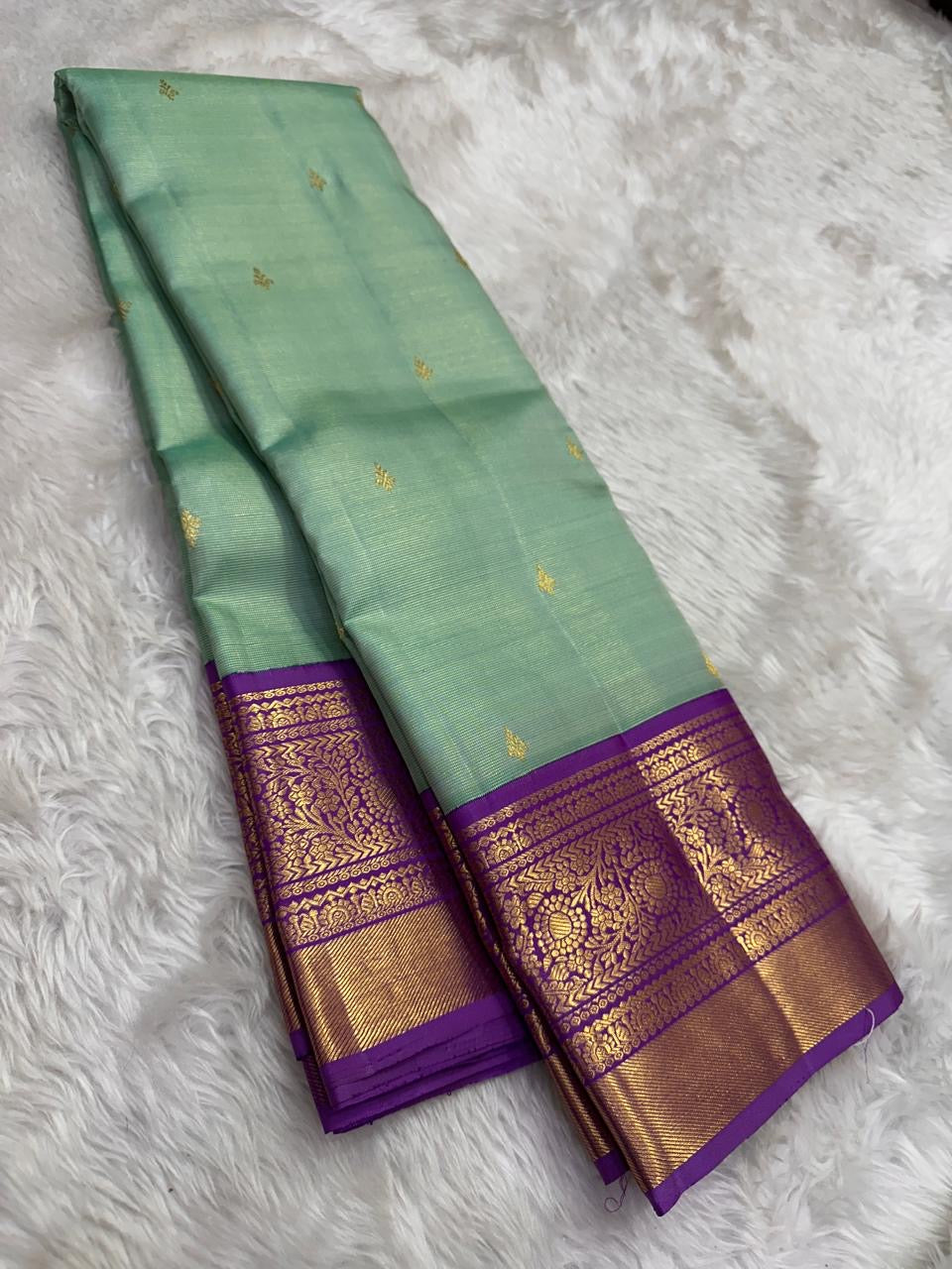 Pastel Mint Green and Royal Orchid Purple Handwoven Pure Silk Kanchipuram Saree with Vairaoosi Korvai Border and Mayil Chakram Butta