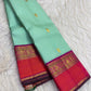 Fresh mint-green Pure Silk Kanjipuram Korvai saree with Mayil and Kamalam buttas and purple coral border.