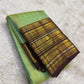 Dense gold zari butta jaal close-up on mint green Kancheepuram pure silk saree — Idam Living