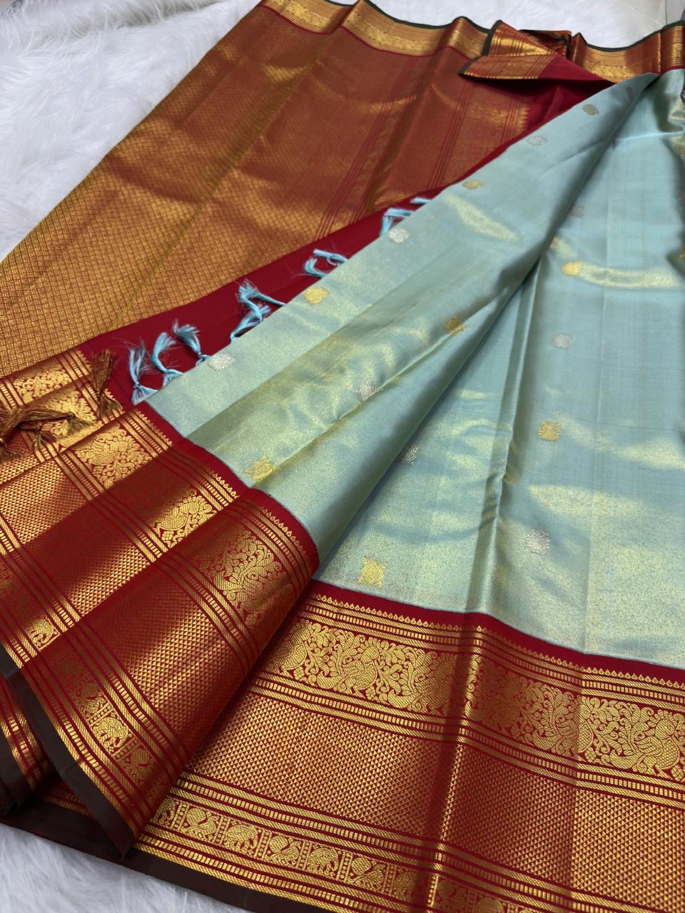 Misty Aqua Blue and Brick Red Handwoven Pure Silk Kanjivaram Saree with Peacock Butta and Korvai Border