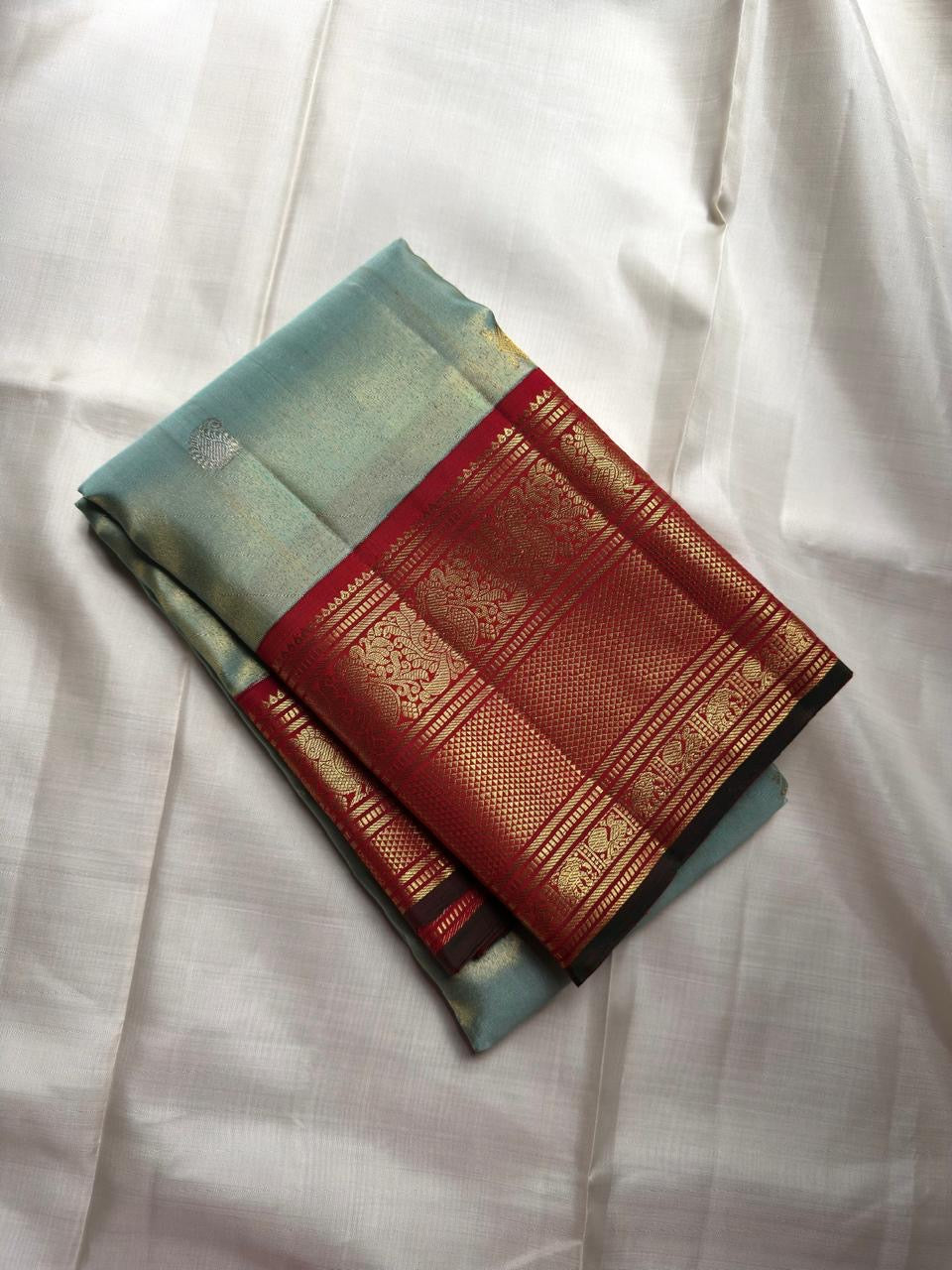 Misty Aqua Blue and Brick Red Handwoven Pure Silk Kanjivaram Saree with Peacock Butta and Korvai Border