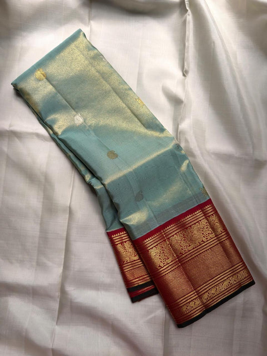 Misty Aqua Blue and Brick Red Handwoven Pure Silk Kanjivaram Saree with Peacock Butta and Korvai Border
