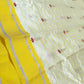 Ivory and yellow Chanderi handloom saree showing fine silver-grey border stripes and coordinating running blouse fabric.