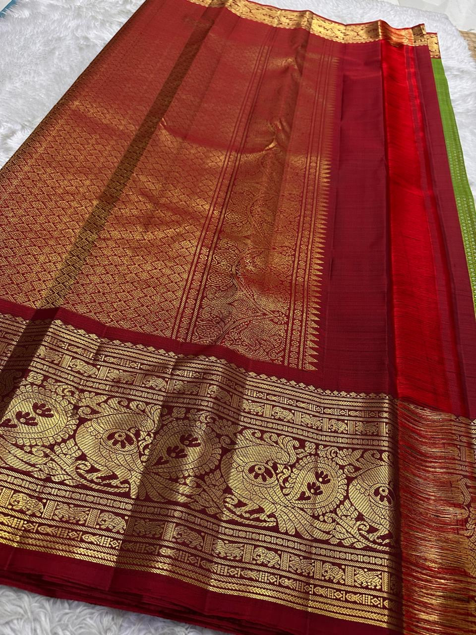 Traditional Kanchipuram Korvai saree in olive green with heritage Gandaberunda weaving and red contrast