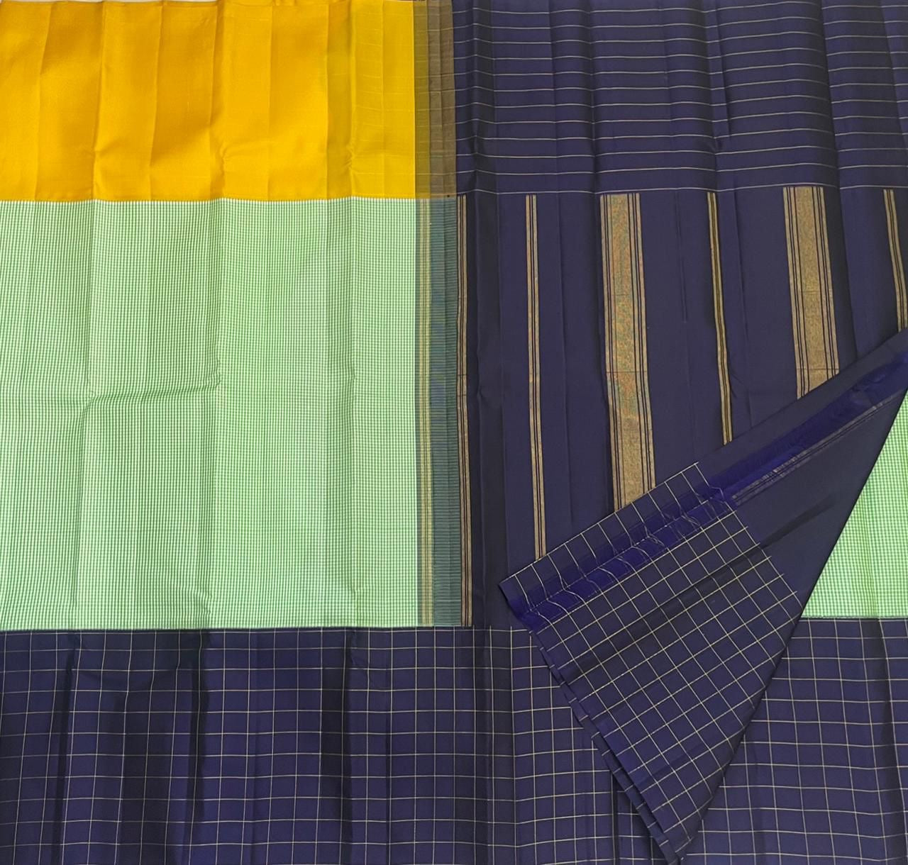 Full view of mubbagam Kanjipuram silk saree in mint green mustard and navy on banana leaf — Idam Living