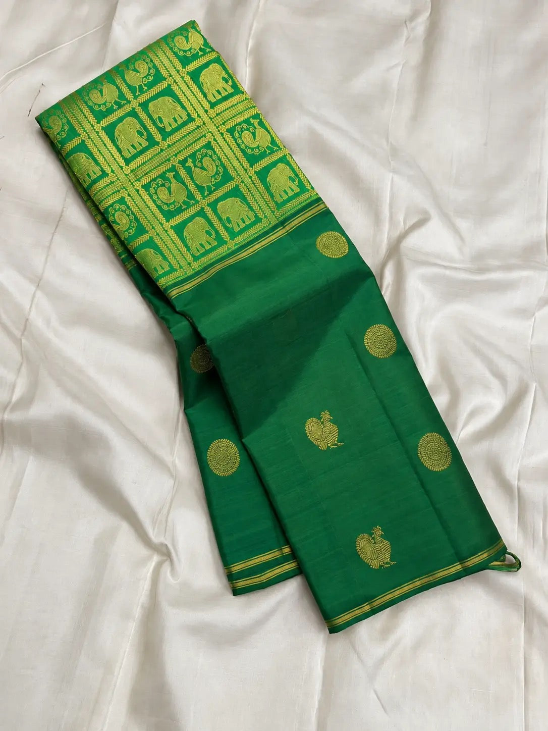 Vintage Pachai Green Kanchipuram silk saree with circular medallion and bird-form gold zari buttas.