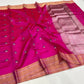 Rani pink Pattu silk Chanderi saree showing floral buttas, broad gold-toned border and shimmering pallu