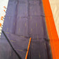 Deep aubergine brown Kanjivaram silk body with restrained gold zari buttas.
