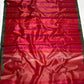 Close view of multicolour cobalt-blue and green buttas woven into Vermilion Red Tissue Silk Chanderi saree