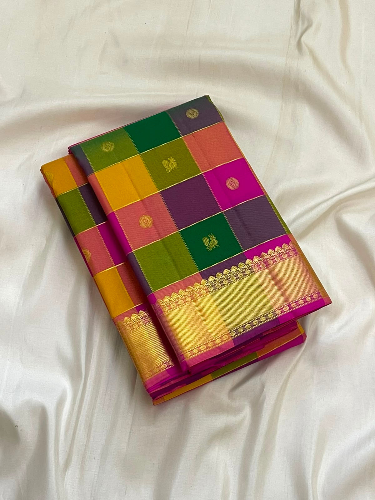 Multicolour checked Kanchipuram silk saree with gold border, folded view