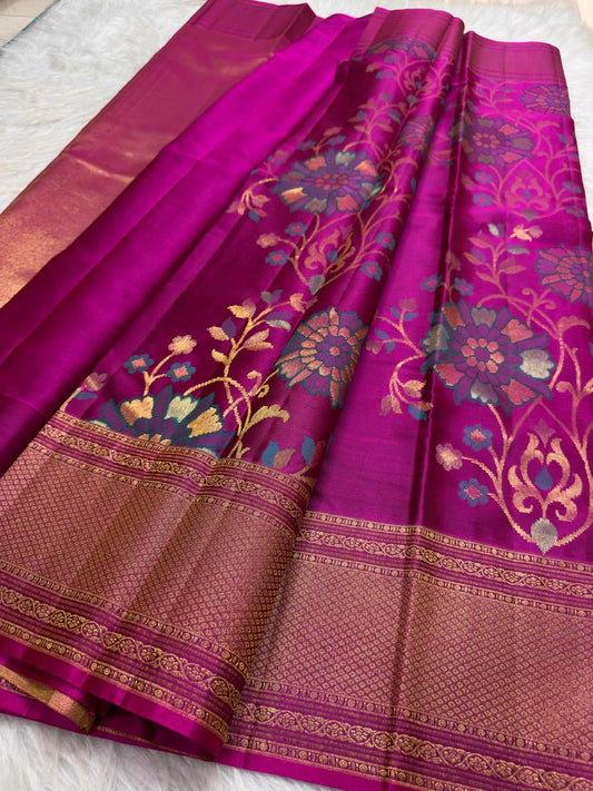 Multicolour floral zari Kanjivaram saree with teal blue peach and gold woven flowers.