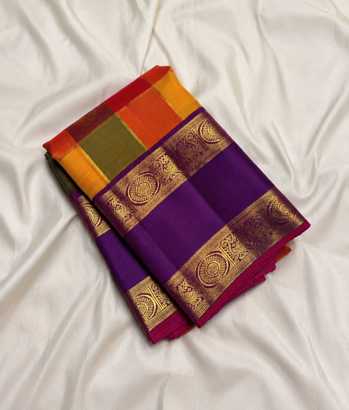 Draped view of the multicolour checked body and royal-purple contrast.
