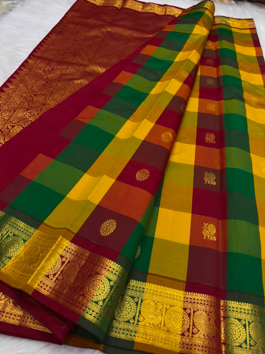 Full view of a lightweight Kanchipuram saree with traditional jewel-toned checks and a contrasting deep red pallu.