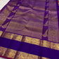 Richly woven royal-purple pallu detail.