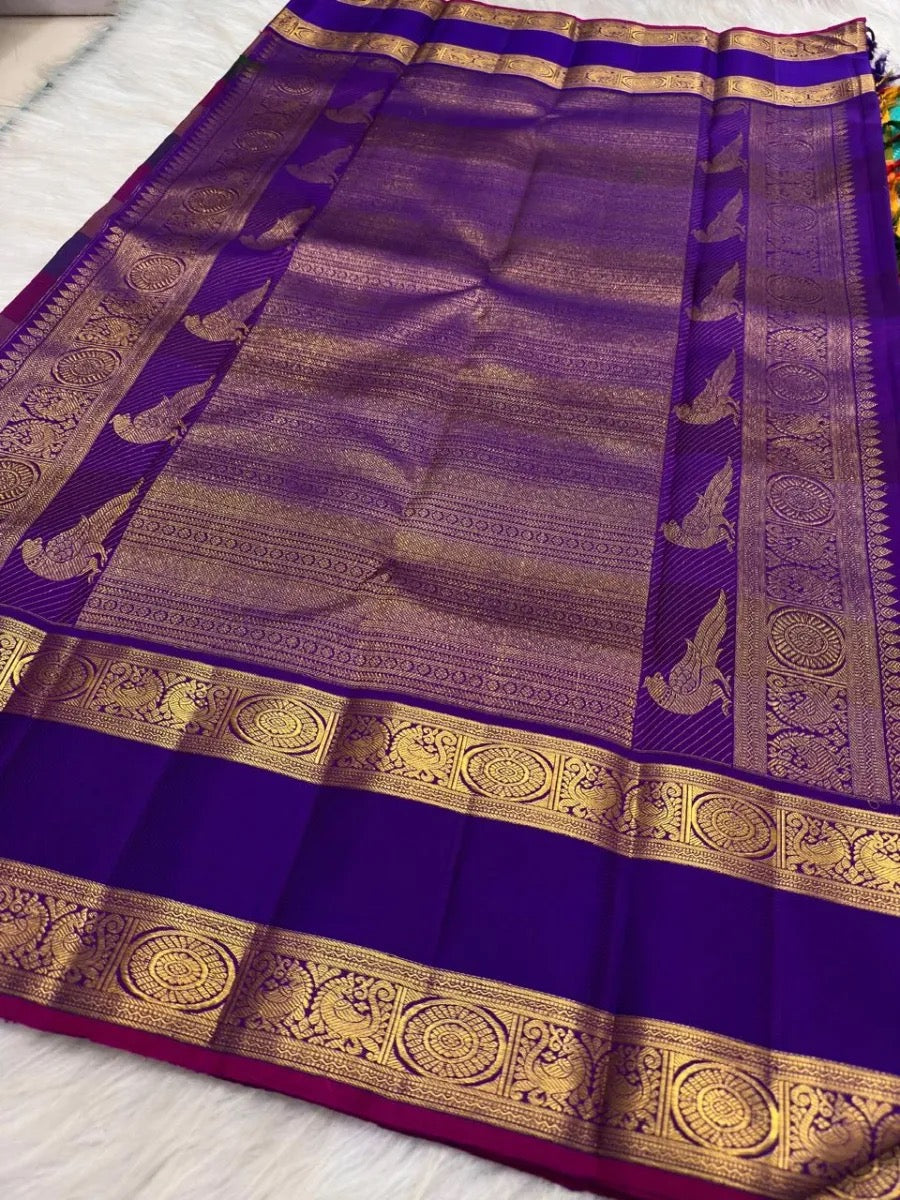 Richly woven royal-purple pallu detail.